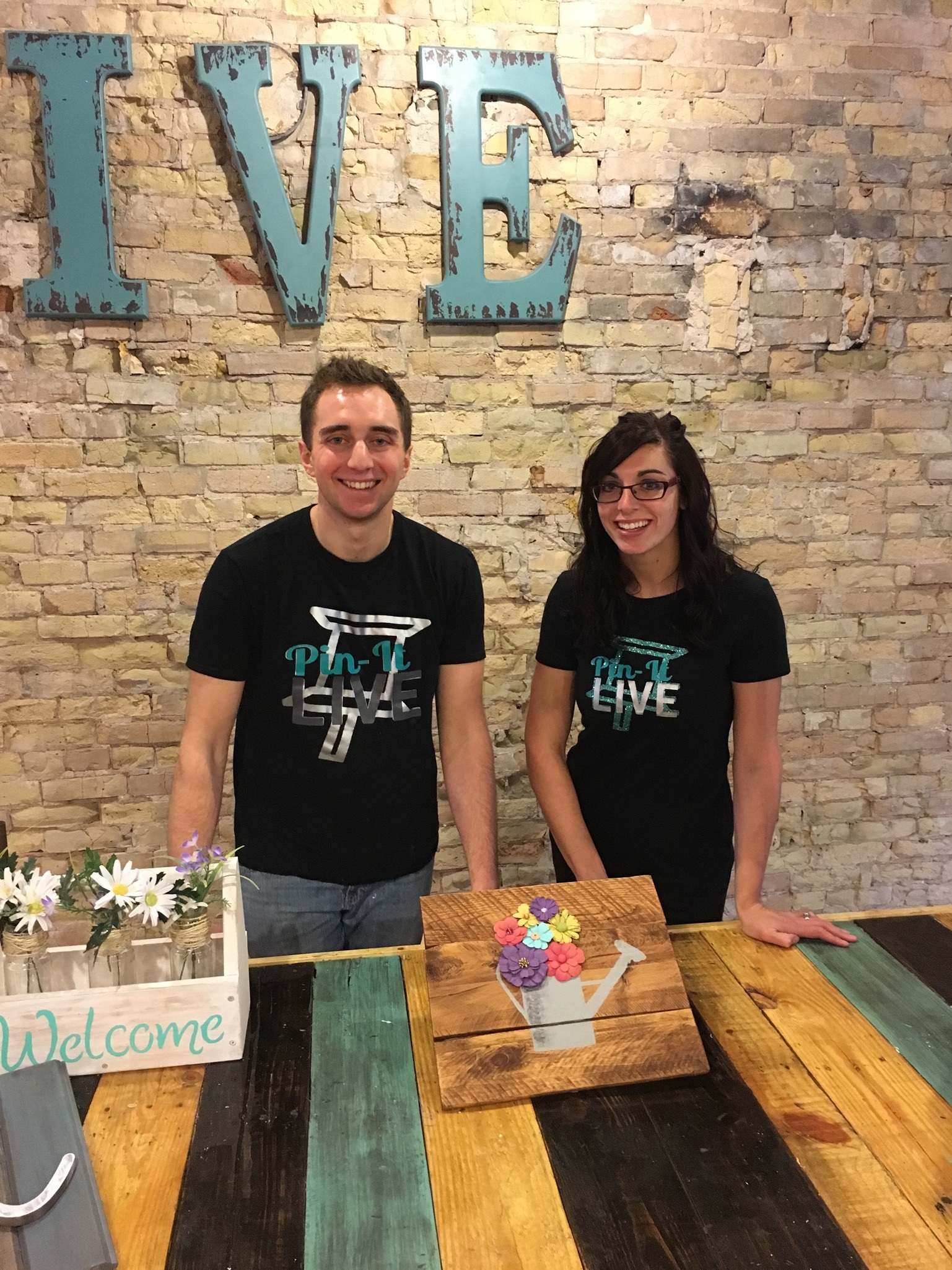 PHOTO: Pin-It Live co-owners Garrett Sheskey and Katie Garcia pose in the Milwaukee studio.