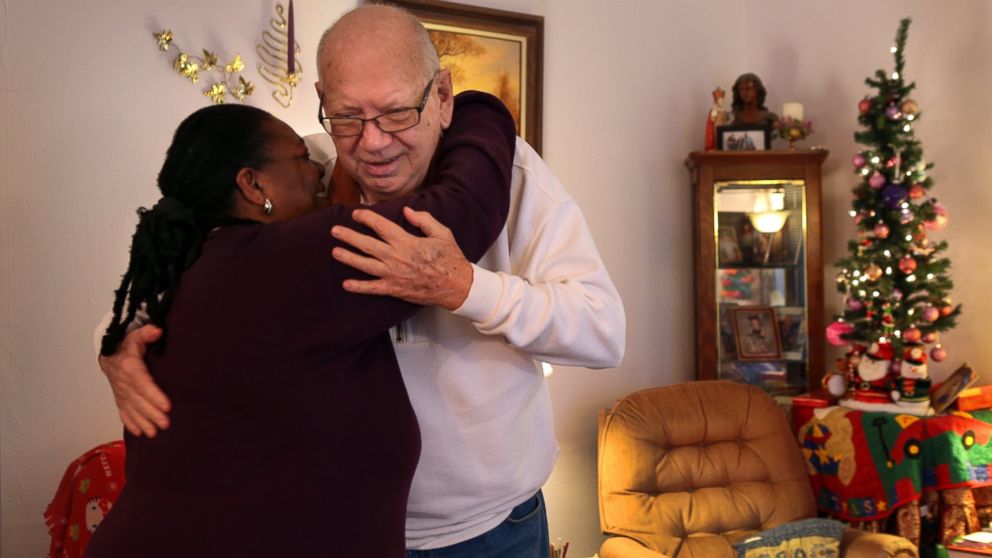 PHOTO: The Reverend Toni DiPina says goodbye to retired St. Louis police officer George Leuckel after meeting in his Oakville, Mo. home, Jan. 3, 2015. 
