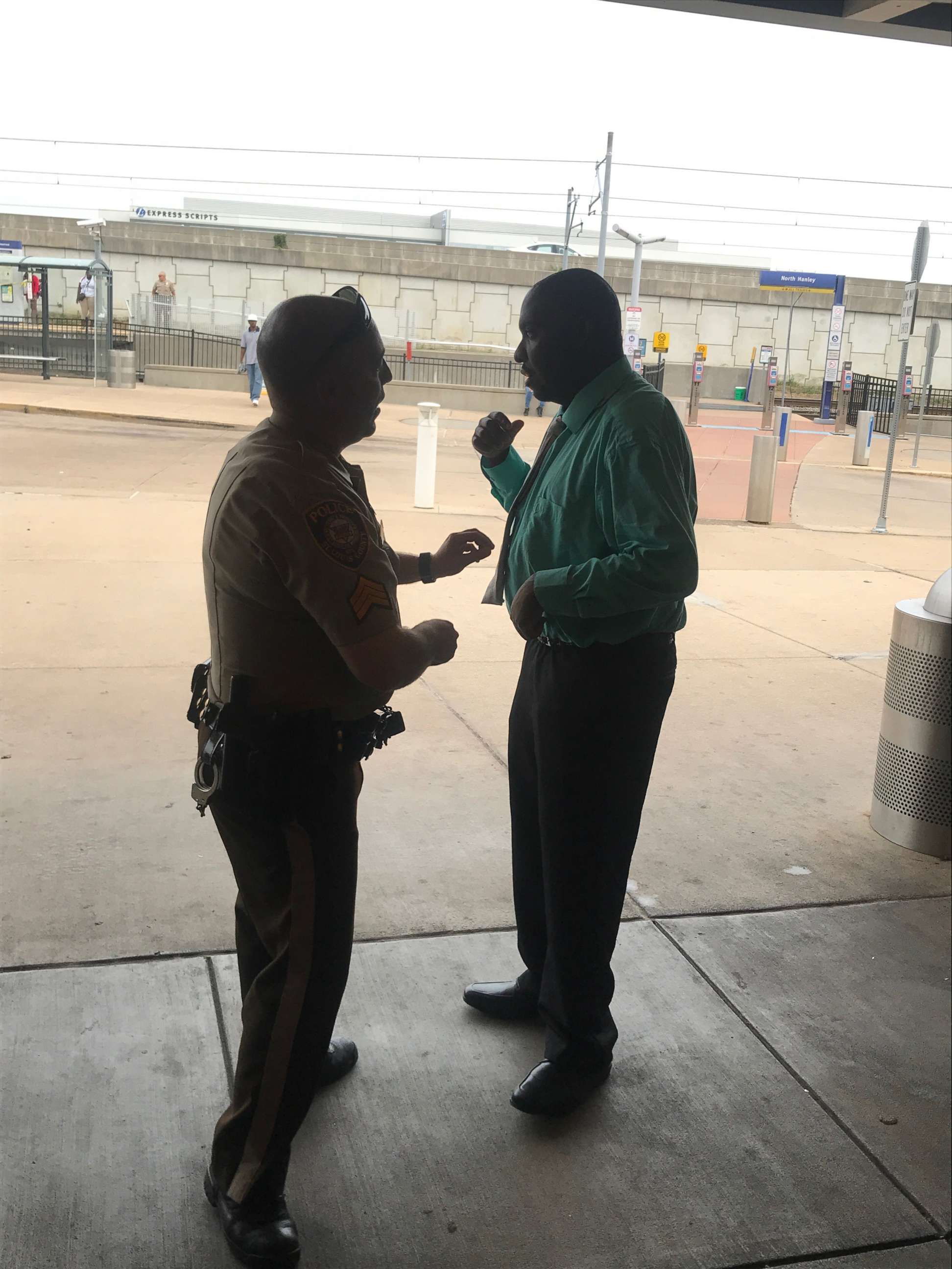 PHOTO: Sergeant Howard Marshall helps Willie Hatcher tie his tie before a job interview in St. Louis, Sept. 18, 2017.