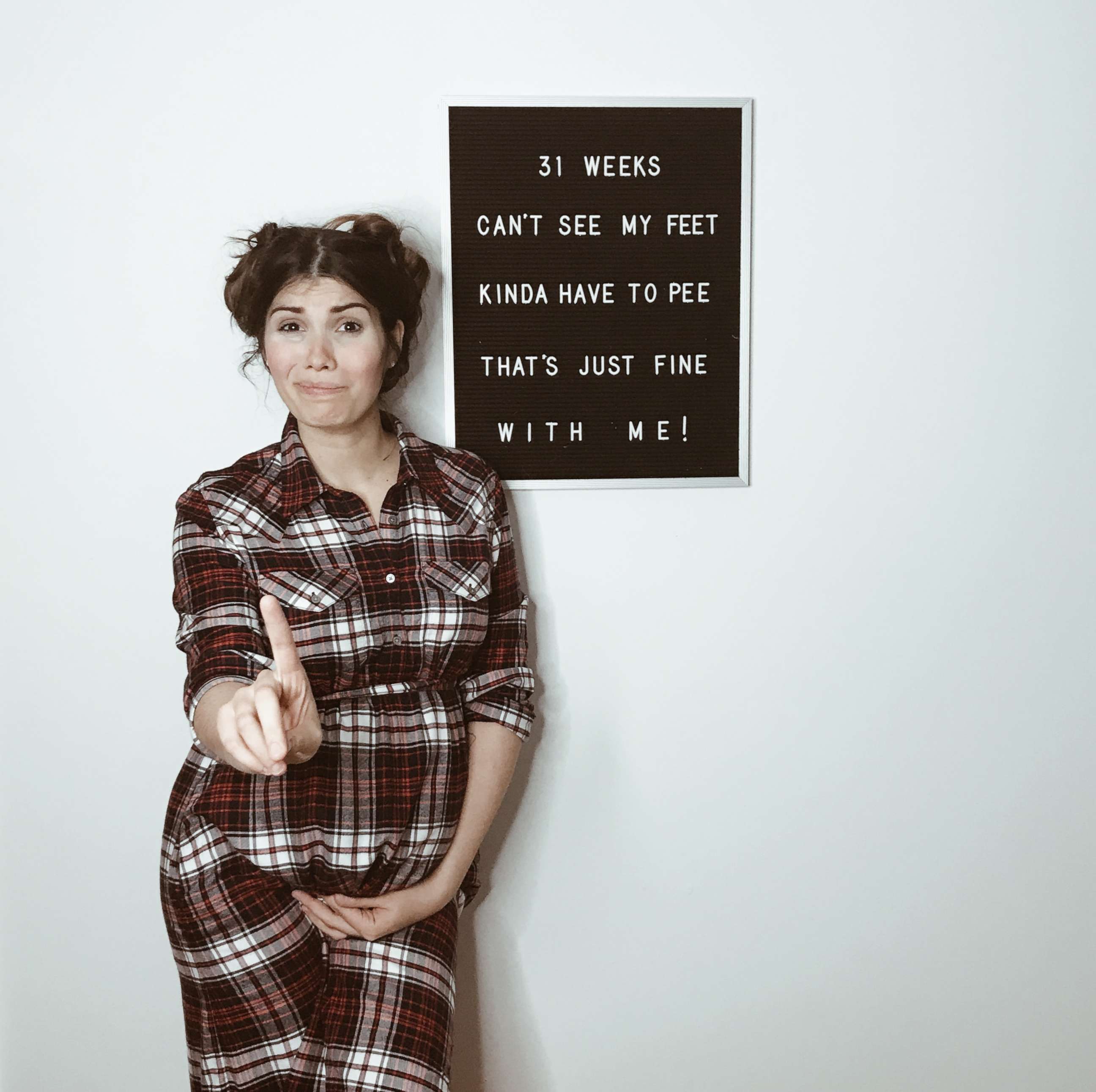 PHOTO: Maya Duca poses alongside her letter board with an updated pregnancy message.