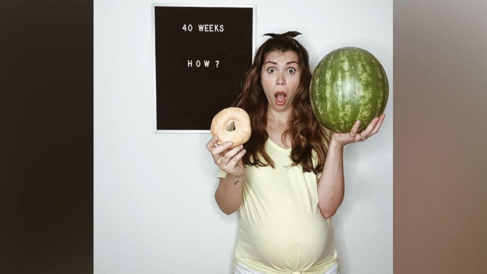PHOTO: Maya Duca poses alongside her letter board with an updated pregnancy message.