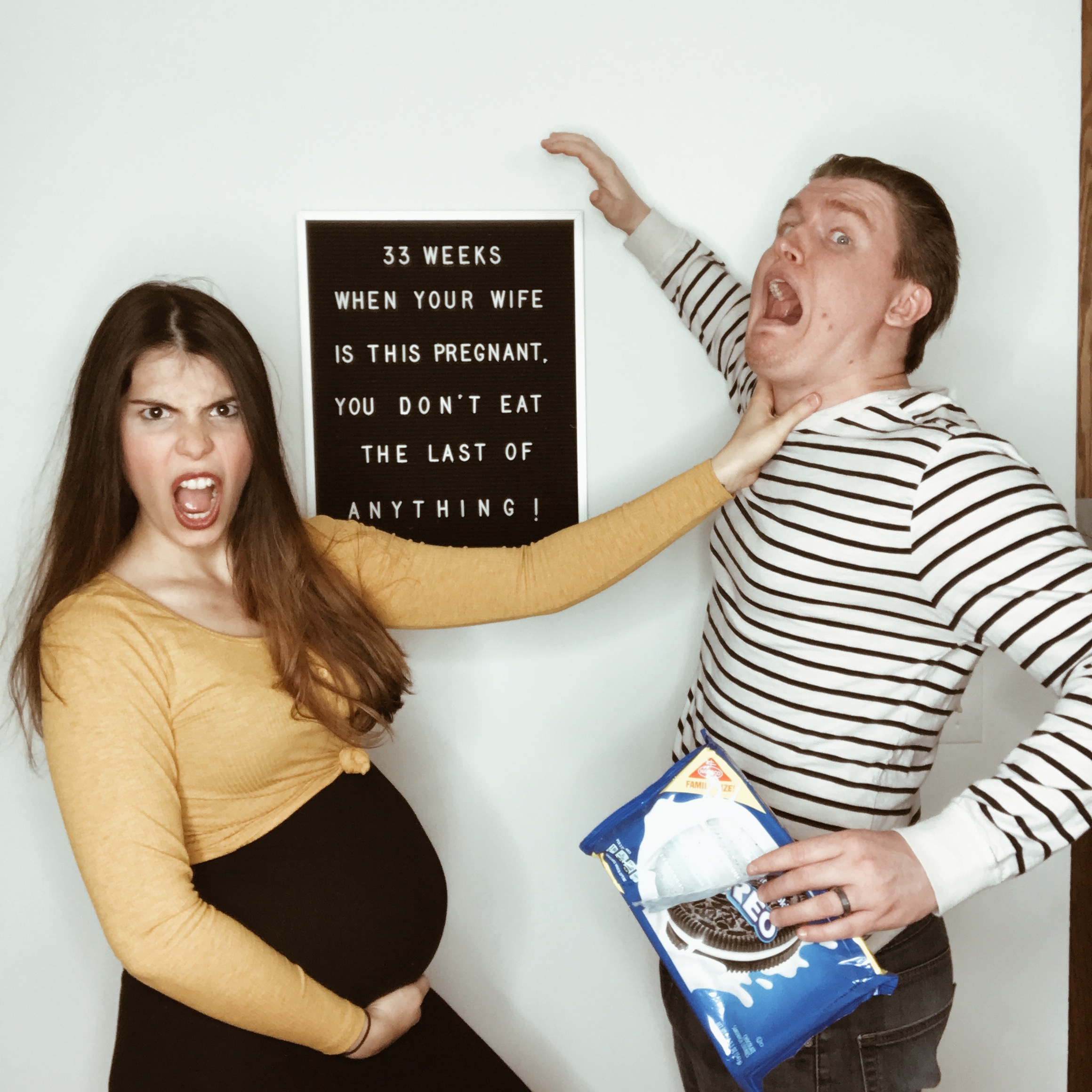 PHOTO: Maya Duca and Tim Vorderstrasse fake fighting over the last cookie during her pregnancy with Hazel.