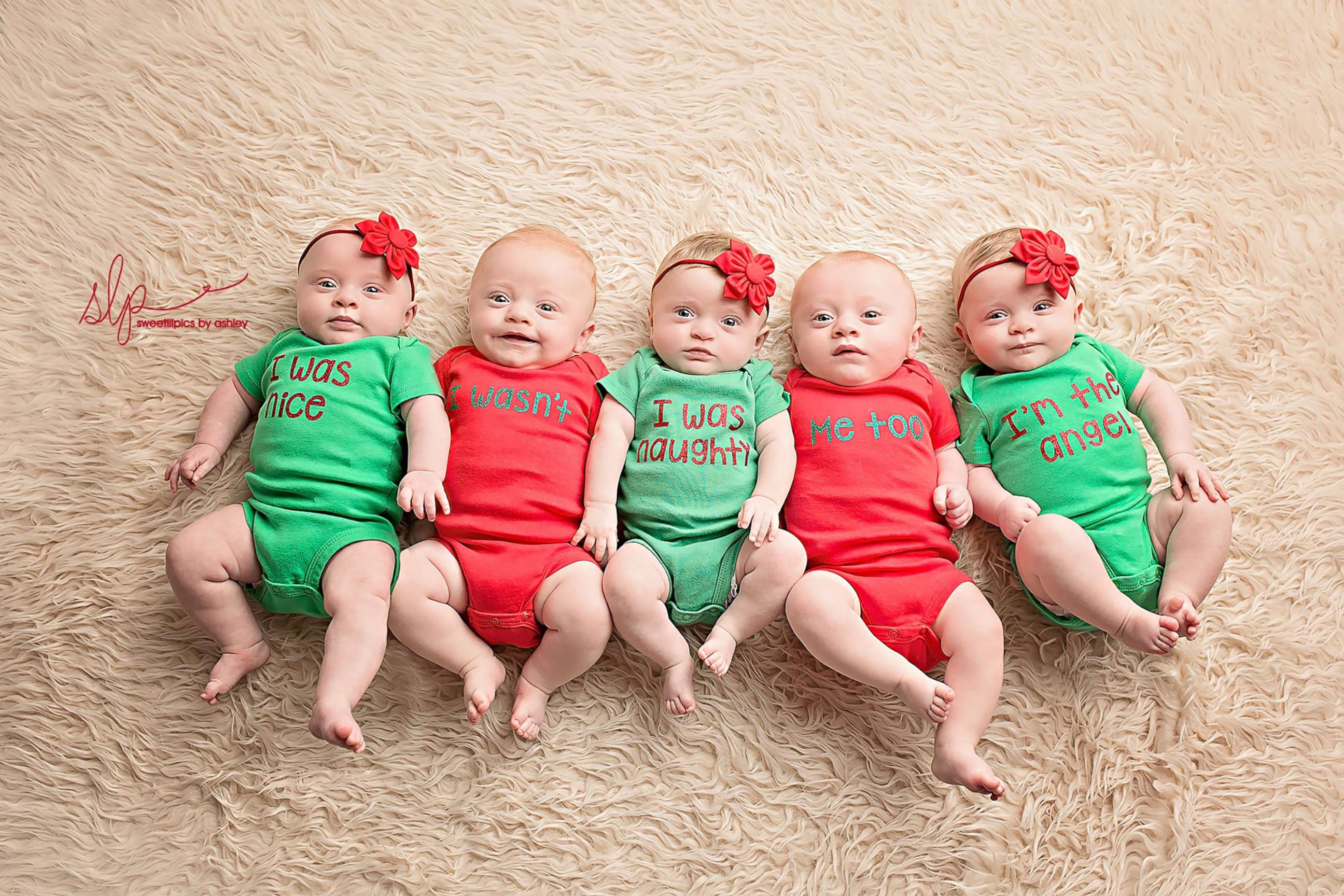 The Driskell quintuplets - Zoey, Asher, Dakota, Gavin and Hollyn, left to right pose in Christmas outfits.