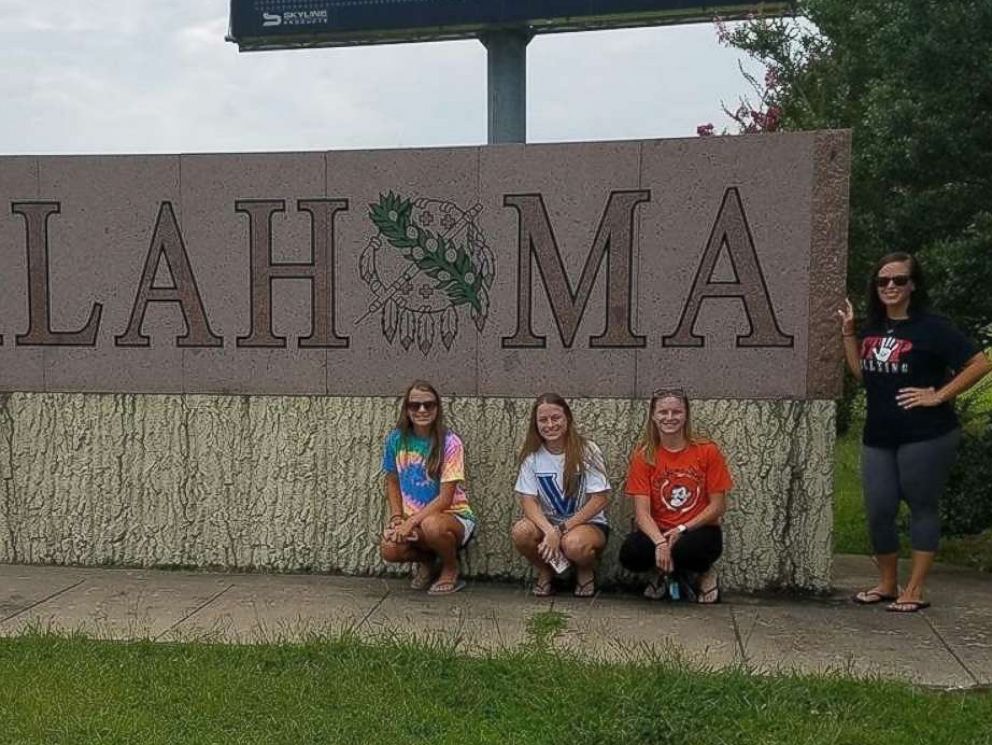 PHOTO: Rachel Murphy, Kelly Murphy, Erin Murphy and their older sister, Lyn Murphy, left to right, pose together at Oklahoma State University.