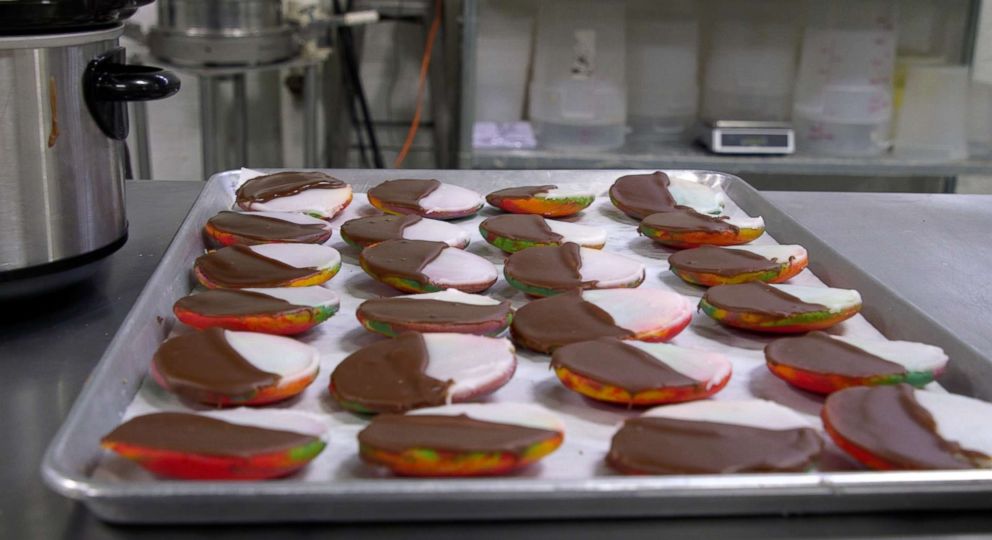 PHOTO: All of the rainbow cookies are iced by hand with melted fondant. 