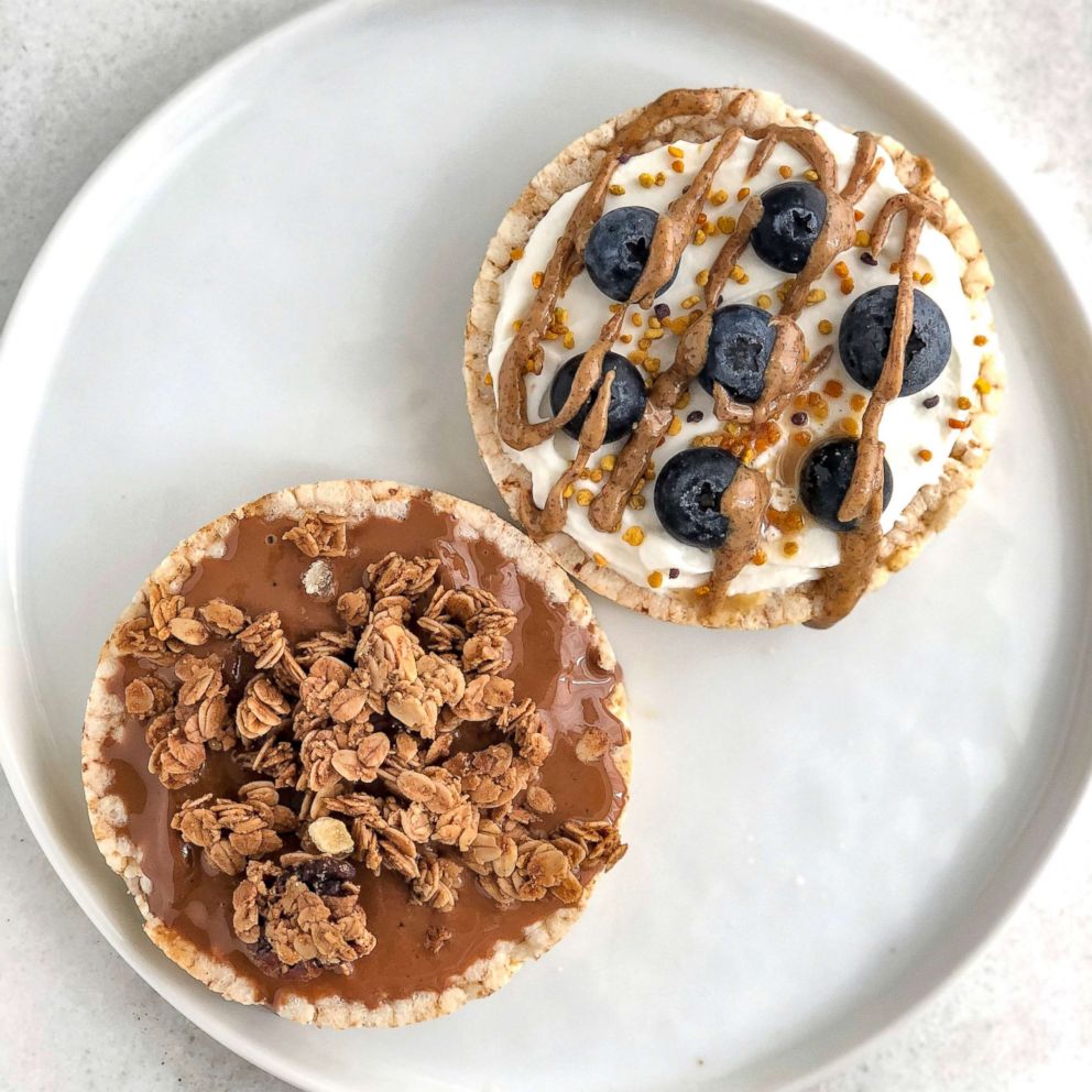 PHOTO: RiceCake Toast - Rice cakes replace bread in this toast topped with almond butter and granola and greek yogurt, blueberries and almond butter with bee pollen on the other one.