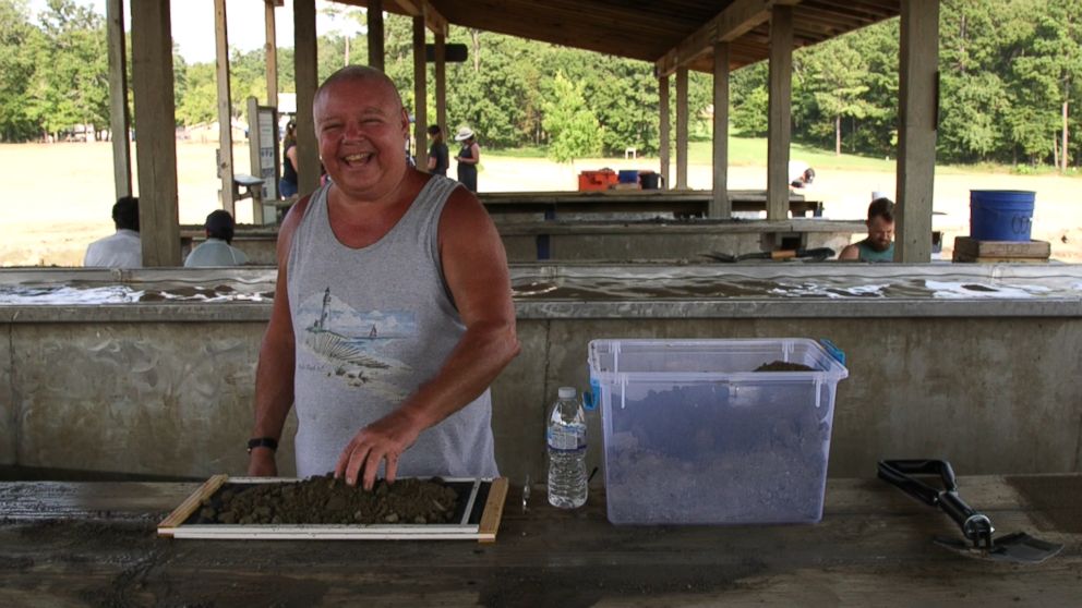 PHOTO: Tourist Rick Claus laughs as he searches for a diamond for his wife at Crater of Diamonds State Park in Murfreesboro, Ark.