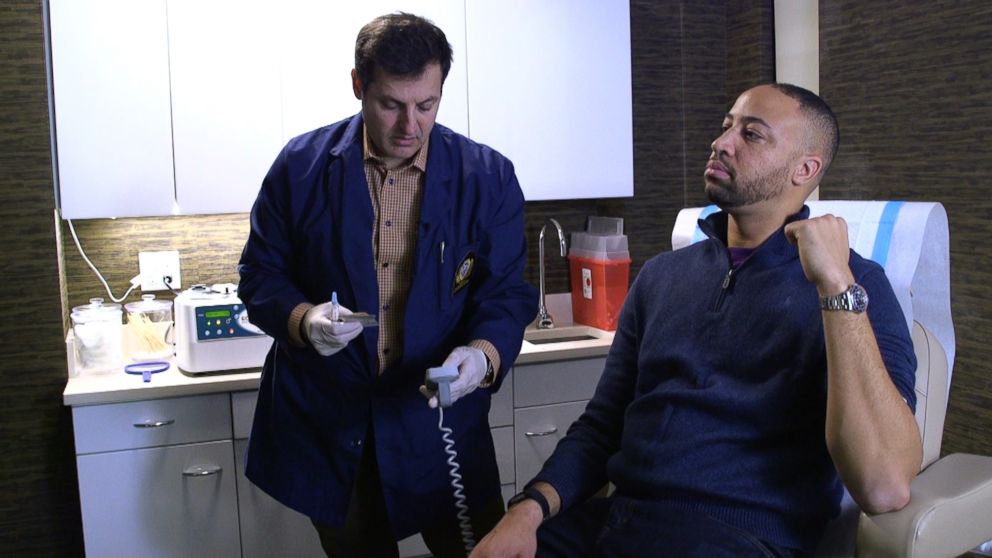 PHOTO: JDr. Norman Rowe, a New York City plastic surgeon, injects a male patient with platelet-rich plasma on a recent visit. 
