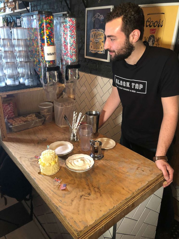 PHOTO: Black Tap Soho and Lower East Side general manager Peter Caporal preps the royal wedding cake shake.