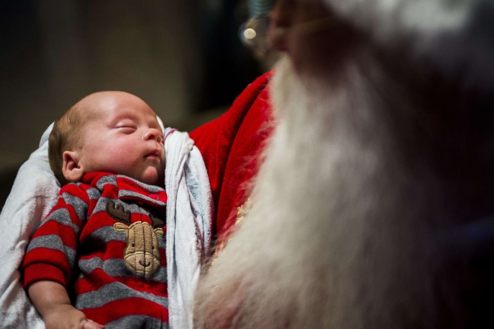 PHOTO: Santa Claus, portrayed by Dale Nowak, smiles as he holds 6-week-old Smith Sparks,  in the Neonatal Intensive Care Unit, Dec. 6, 2017, at Hurley Medical Center in Flint, Mich.