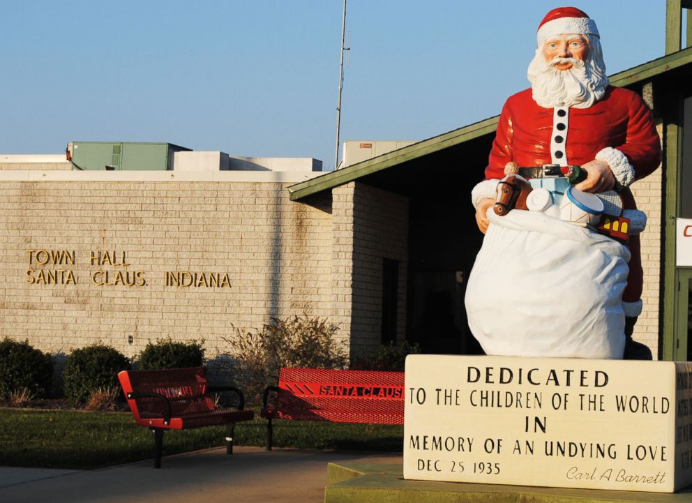 PHOTO: A statue of Santa Claus stands outside the town hall in Santa Claus, Ind.