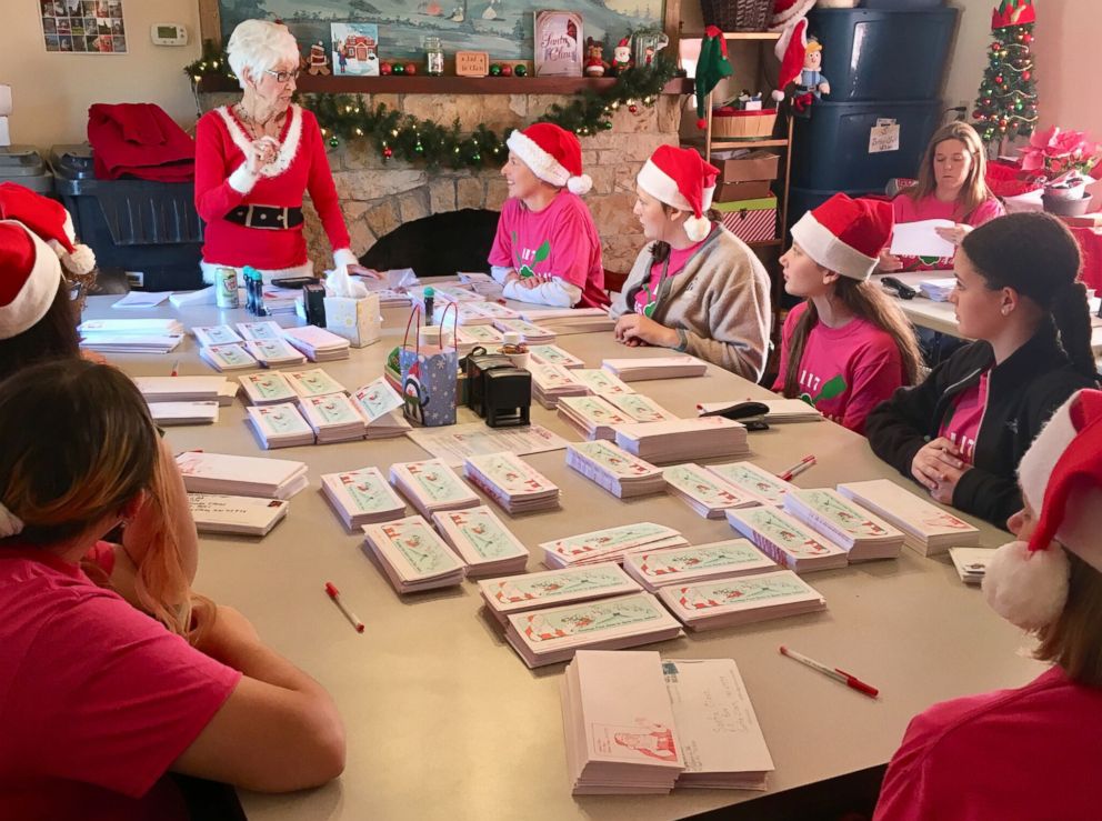 PHOTO: Pat Koch, standing, instructs volunteers in Santa Claus, Indiana.