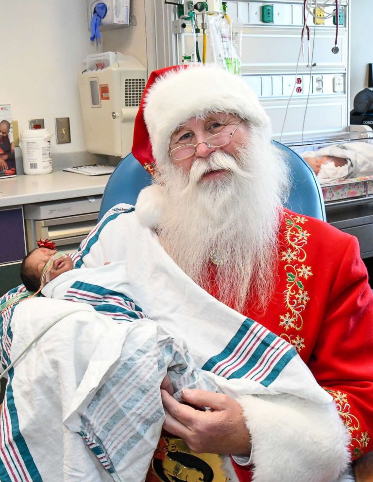PHOTO: The hospital printed the photos of Santa with each child as a keepsake for the families.