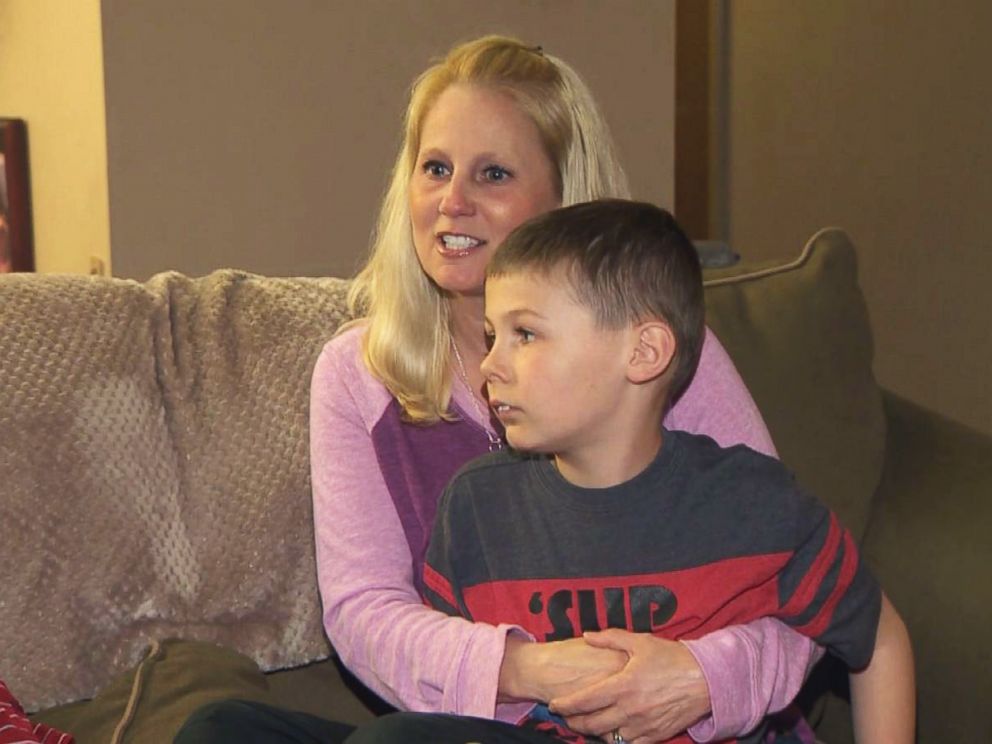 PHOTO: Tammy Aikins, 44, a mother of two from Monroeville, Pa., holds her son, Tyler, 8, during an interview.