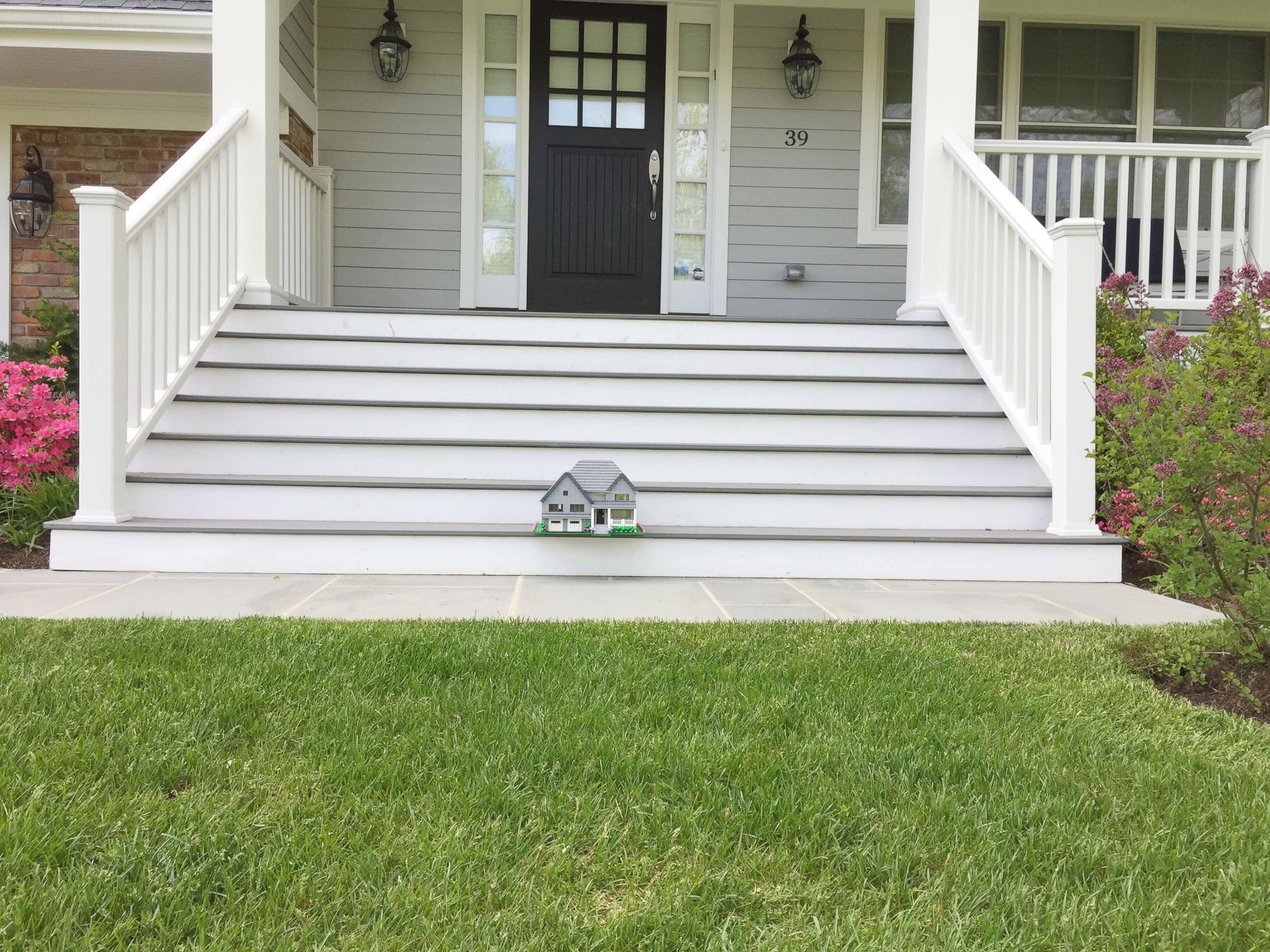 PHOTO: A Lego home built by Shari Austrian sits on the front steps of the actual home.