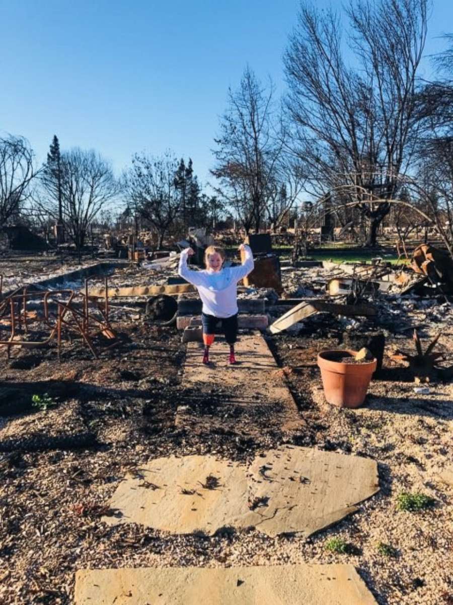 PHOTO: Lily Biagini, 10, stands on the remains of her family's home in Santa Rosa, Calif.