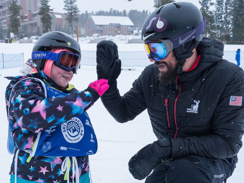 PHOTO: Lilly Biagini, 10, gives Keith Gabel, a U.S. Paralympian, a high five.