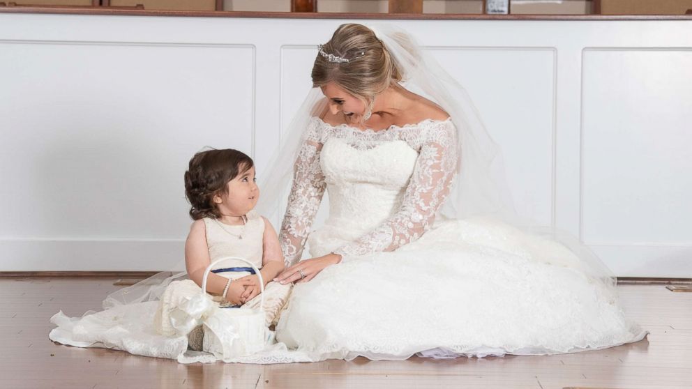 3 year old cancer survivor is flower girl at her bone marrow donor s wedding She saved our daughter s life ABC News