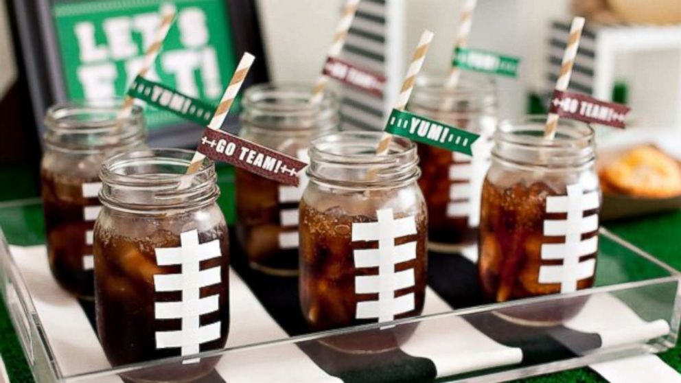 PHOTO: Add a fun DIY football mason jar to your table. Jennifer Sbranti, founder and creative director of Hostess with the Mostess, uses white duct tape to make football laces.