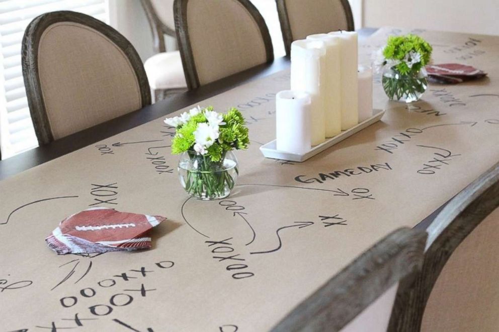 PHOTO: Allison Cawley of PeachfullyChic.com shared an idea on her blog for a creative tables cape using craft paper to create a football-themed playbook as a table runner.