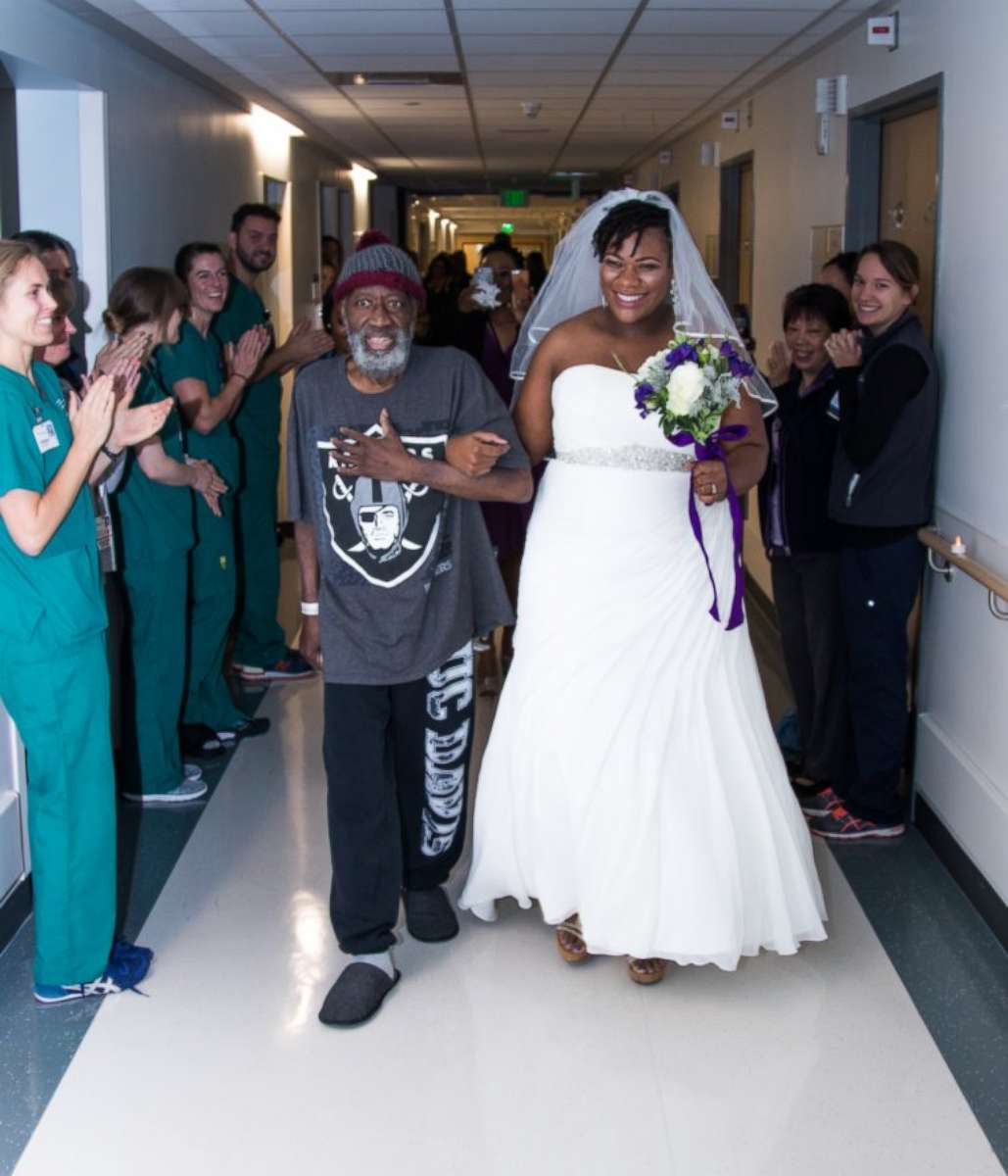 PHOTO: Preston Rolan, who is battling leukemia at UCSF Medical Center in San Francisco, walks his daughter, Vieneese Stanton, down the hospital's hallways on her wedding day.