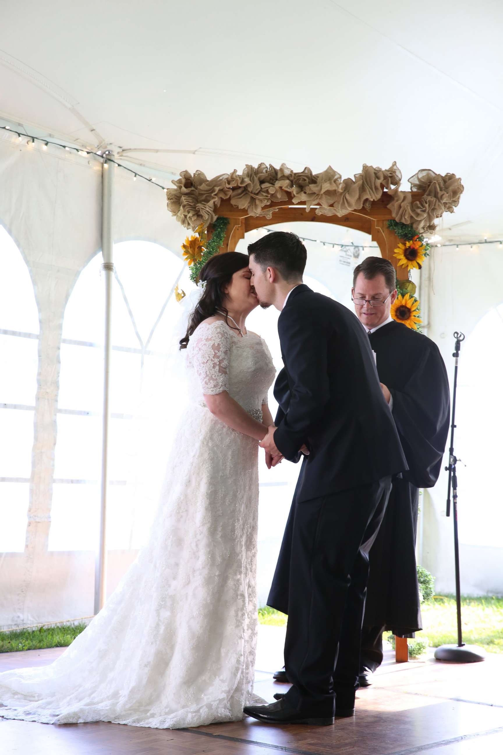PHOTO: Jennifer Jensen, 24, and Bill Jensen, 27, kiss after being married by Judge Chris Wilton.