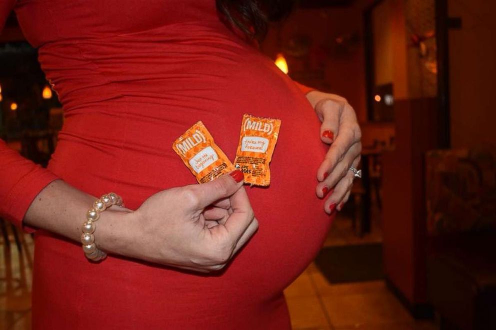 PHOTO: Kristin Johnston poses during her maternity photo shoot in front of her local Taco Bell in Atlanta, Georgia.