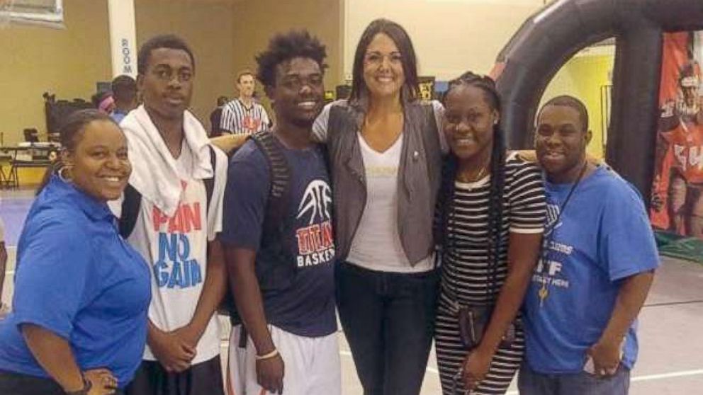 Carolynn Smith of Tampa poses with her mentees from the Boys and Girls Club. 