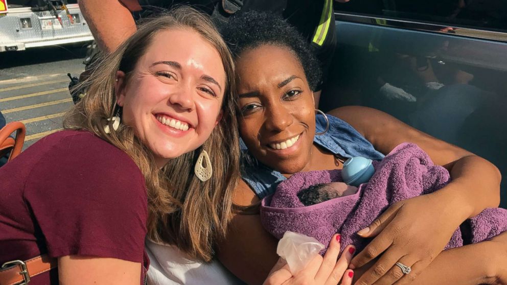 PHOTO: Caris Lockwood, 24, a labor nad delivery nurse from Atlanta, Georgia, delivered the baby boy of Tanya Saint Preux Picault on Aug. 25 outside the entrance of a Target store near the Mall of Georgia in Buford, Georgia. 