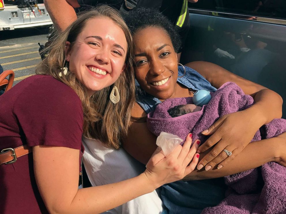 PHOTO: Caris Lockwood, 24, a labor nad delivery nurse from Atlanta, Georgia, delivered the baby boy of Tanya Saint Preux Picault on Aug. 25 outside the entrance of a Target store near the Mall of Georgia in Buford, Georgia.