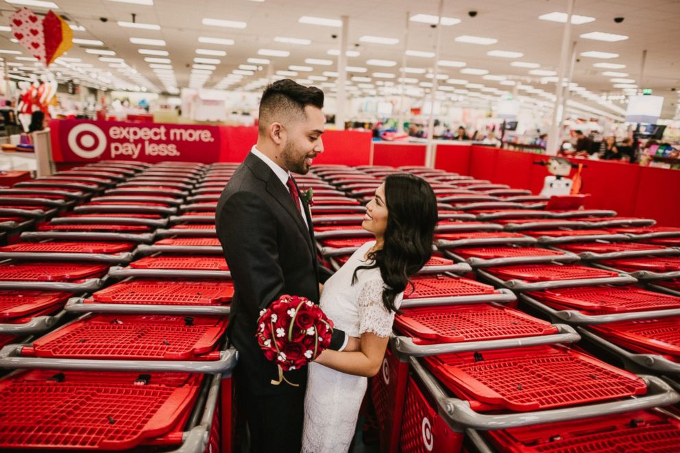 PHOTO: Newlyweds Michael Delvalle and Isabella Sablan pose among shopping carts inside a North Miami, Florida-area Target.