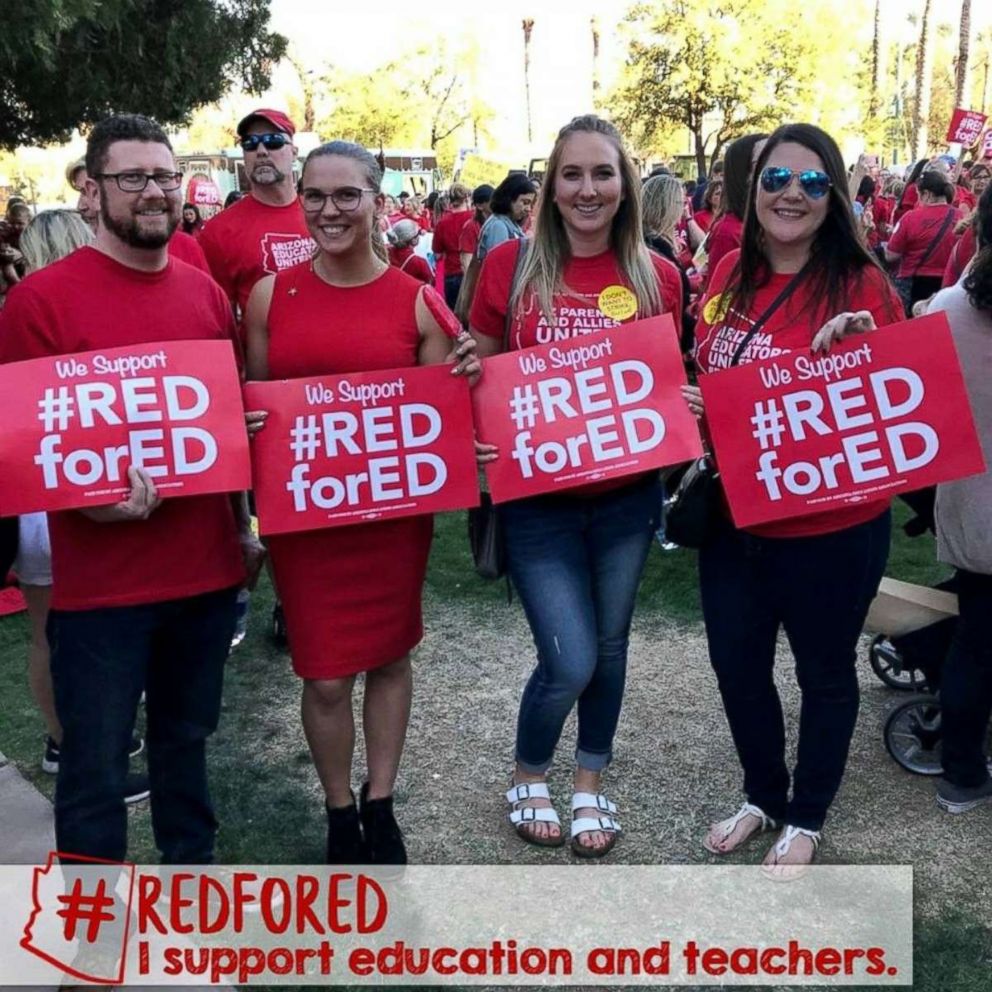 PHOTO: From right to left, Kayla Miller, a school psychologist, Christina Boudreau, a public health worker, Heidi Richmond, a marketing manager and Jim Jackson, a State Farm Insurance worker, rally at the Arizona state capitol in Phoenix on April 4, 2018.