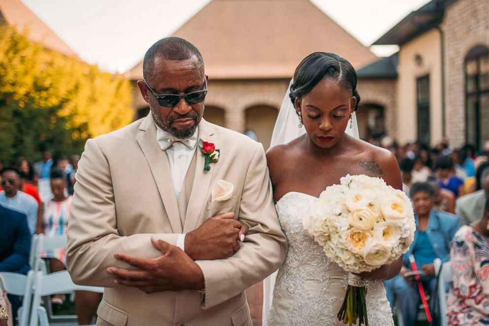 PHOTO: Tearra Suber and her father walk down the aisle on Sept. 4, 2016.