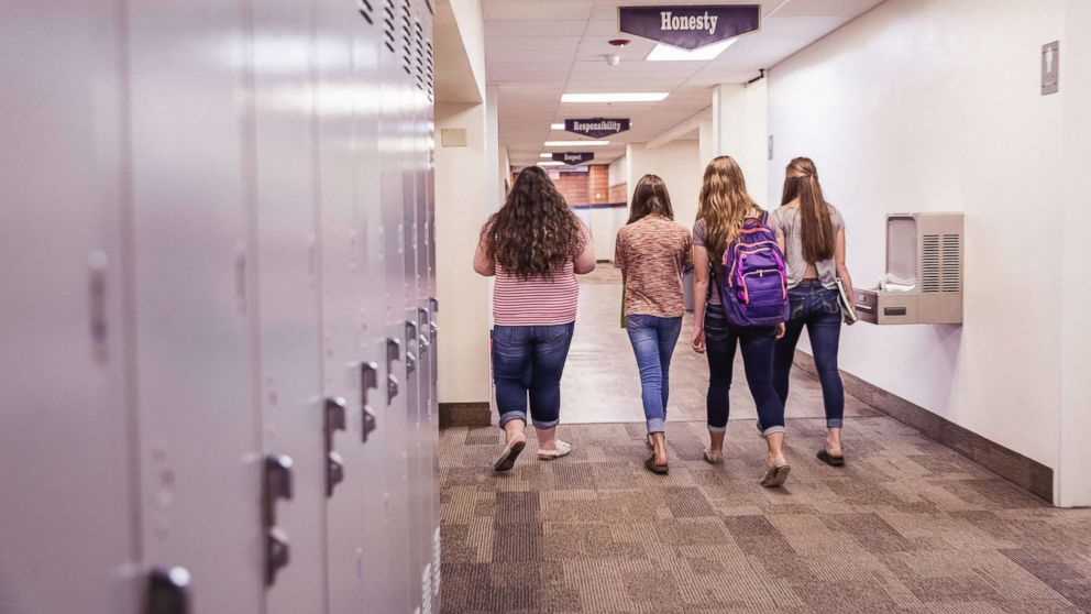 PHOTO: A group of teenage high school girls walking down the hallway in school in this undated stock photo.