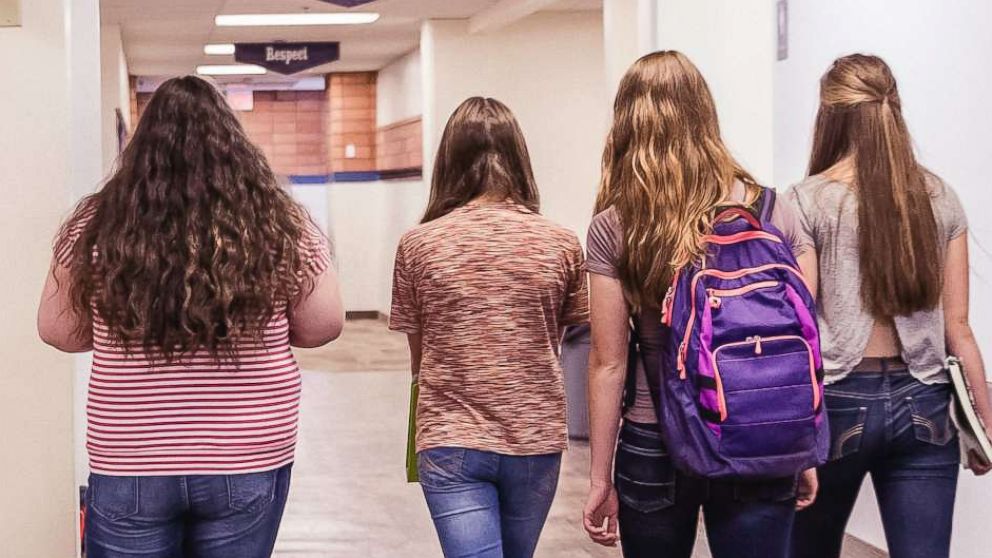 PHOTO: A group of teenage high school girls walking down the hallway in school in this undated stock photo.