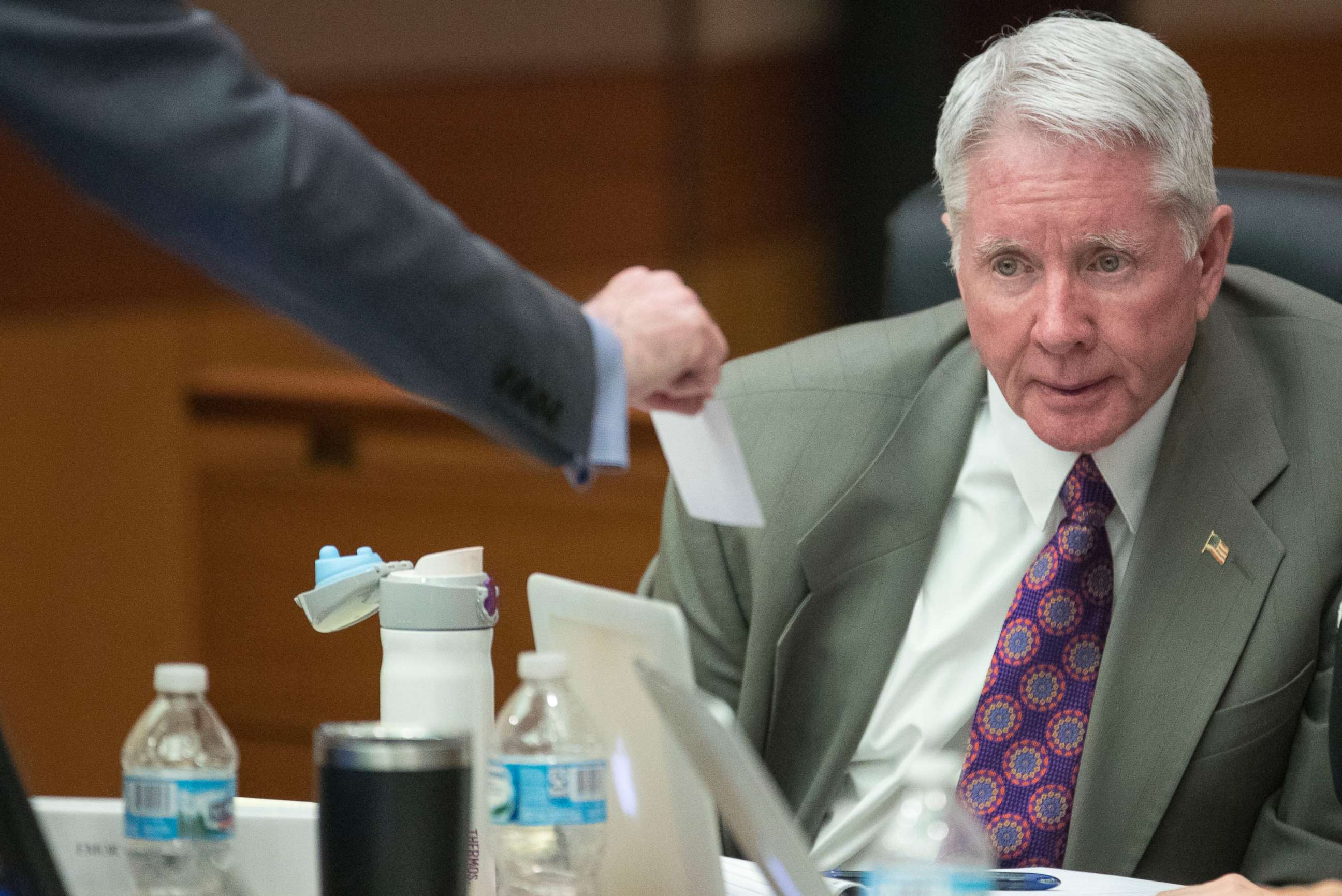 PHOTO: Tex McIver reads over questions put together by the jury before a witness leaves the stand during his trial, March 14, 2018, in Atlanta. 