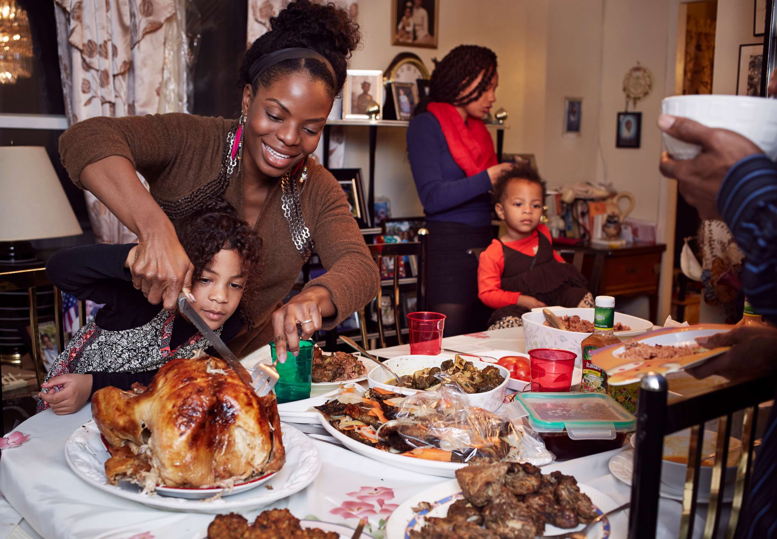 PHOTO: A family gathers around the dinner table. 