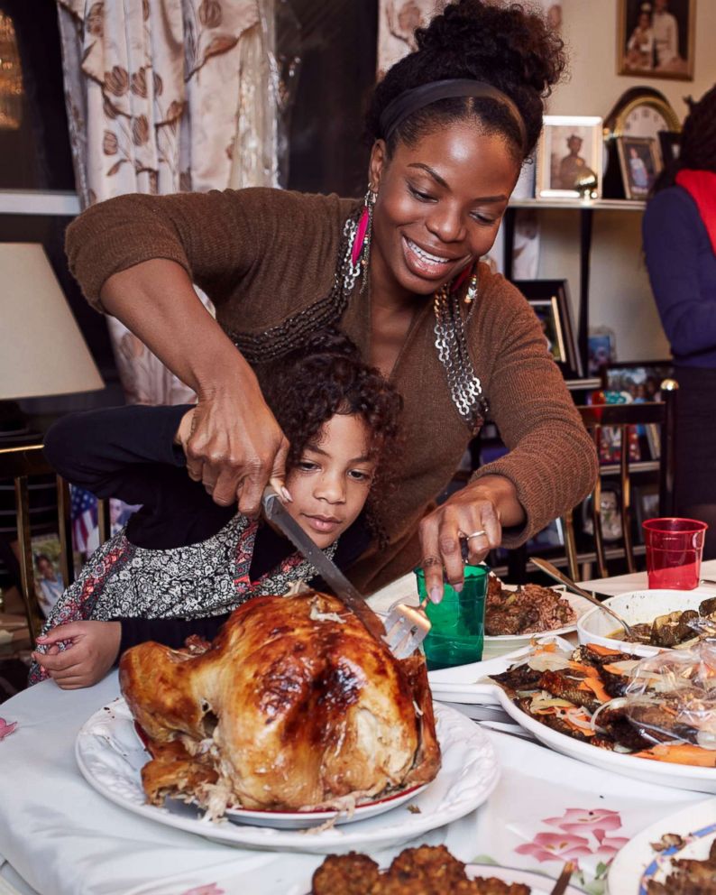 PHOTO: A family gathers around the dinner table. 