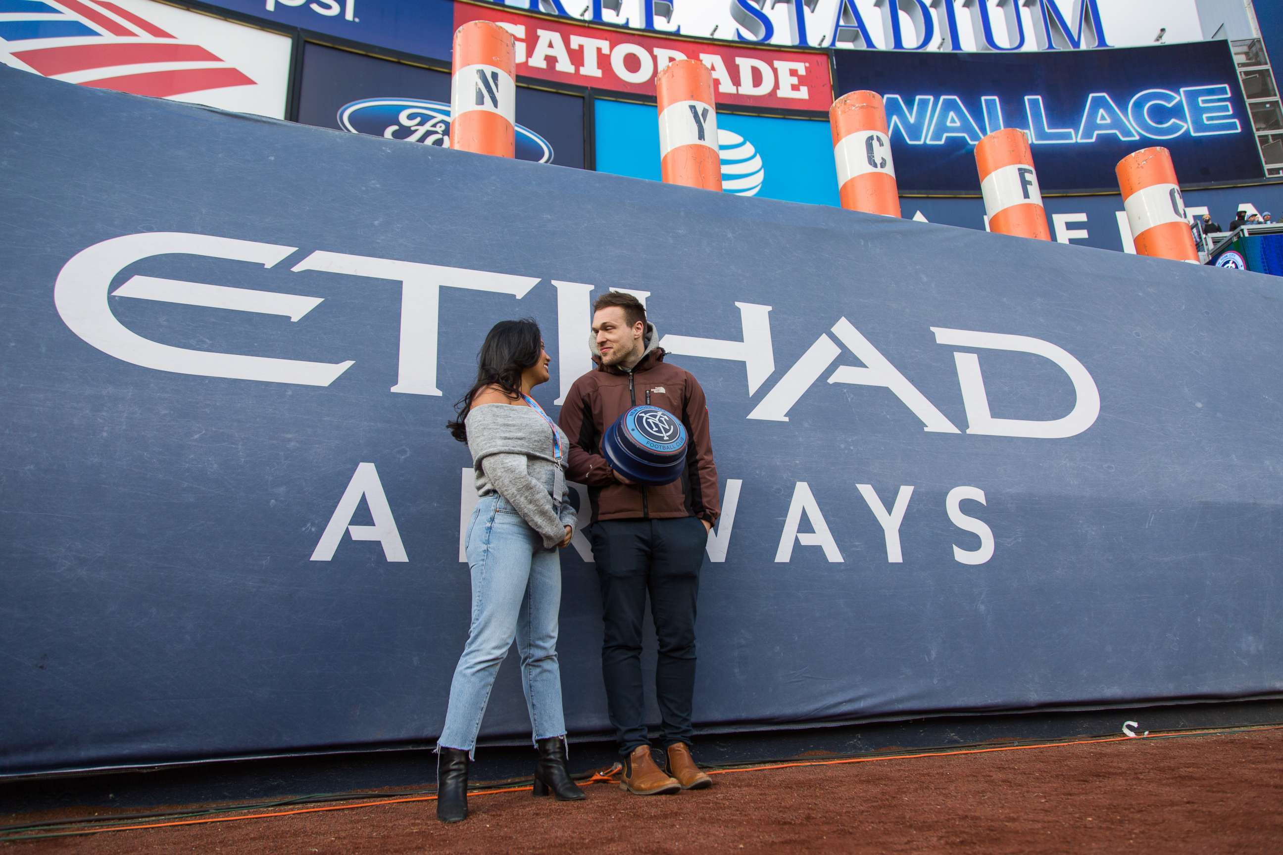 PHOTO: Alexa Valiente and her Tinder date Walter prepare to light the NYCFC Smoke Stacks and start the game on April 29, 2018. 