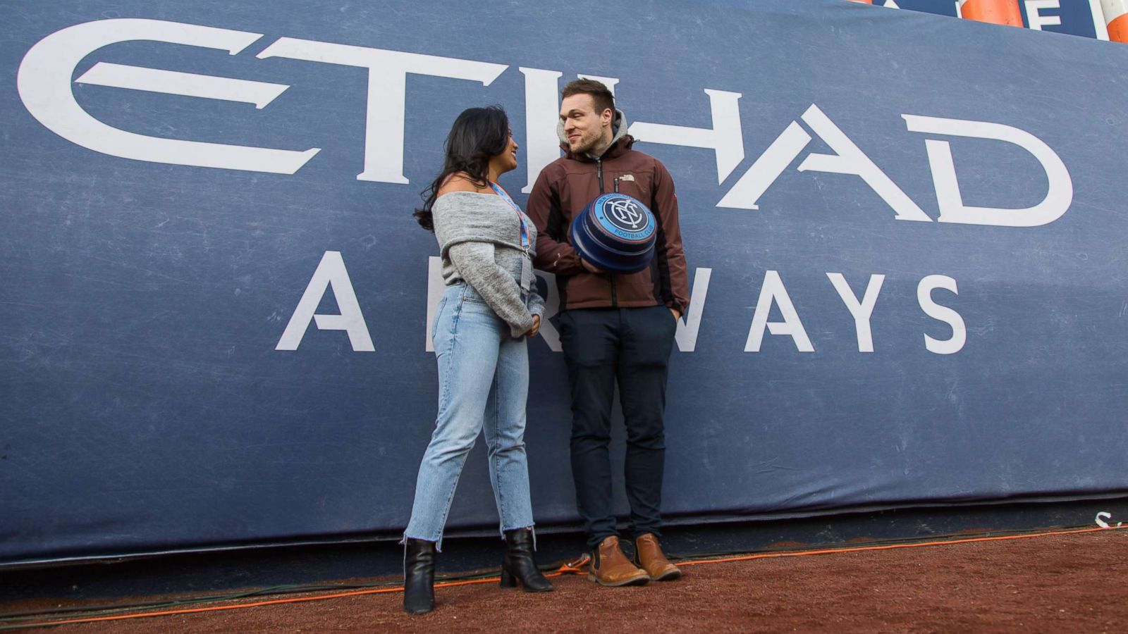 PHOTO: Alexa Valiente and her Tinder date Walter prepare to light the NYCFC Smoke Stacks and start the game on April 29, 2018.