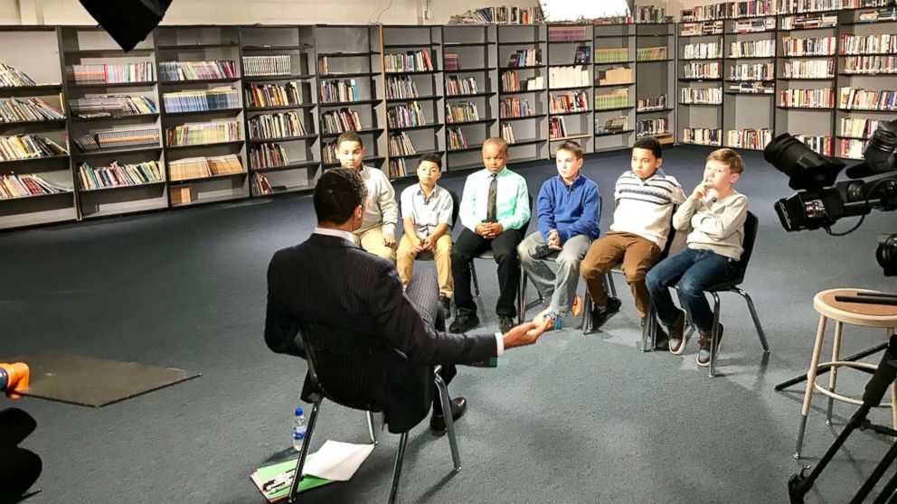 PHOTO: ABC News' T. J. Holmes speaks with a group of boys ages seven to 10 in the Houston area.