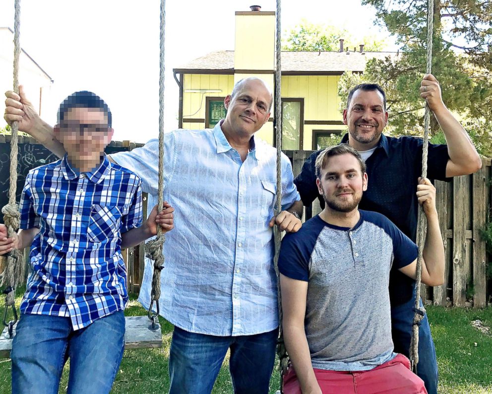 PHOTO: T.J. Sullivan and his husband Scott Strong with their two adopted sons, 24-year-old Isaiah and 15-year-old Tim.