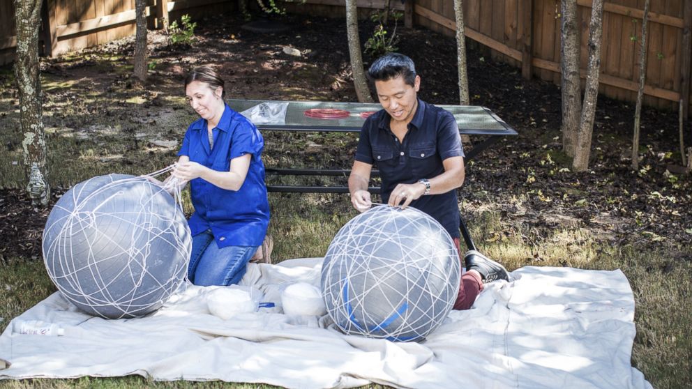 Vern Yip works alongside a homeowner on "Trading Spaces."