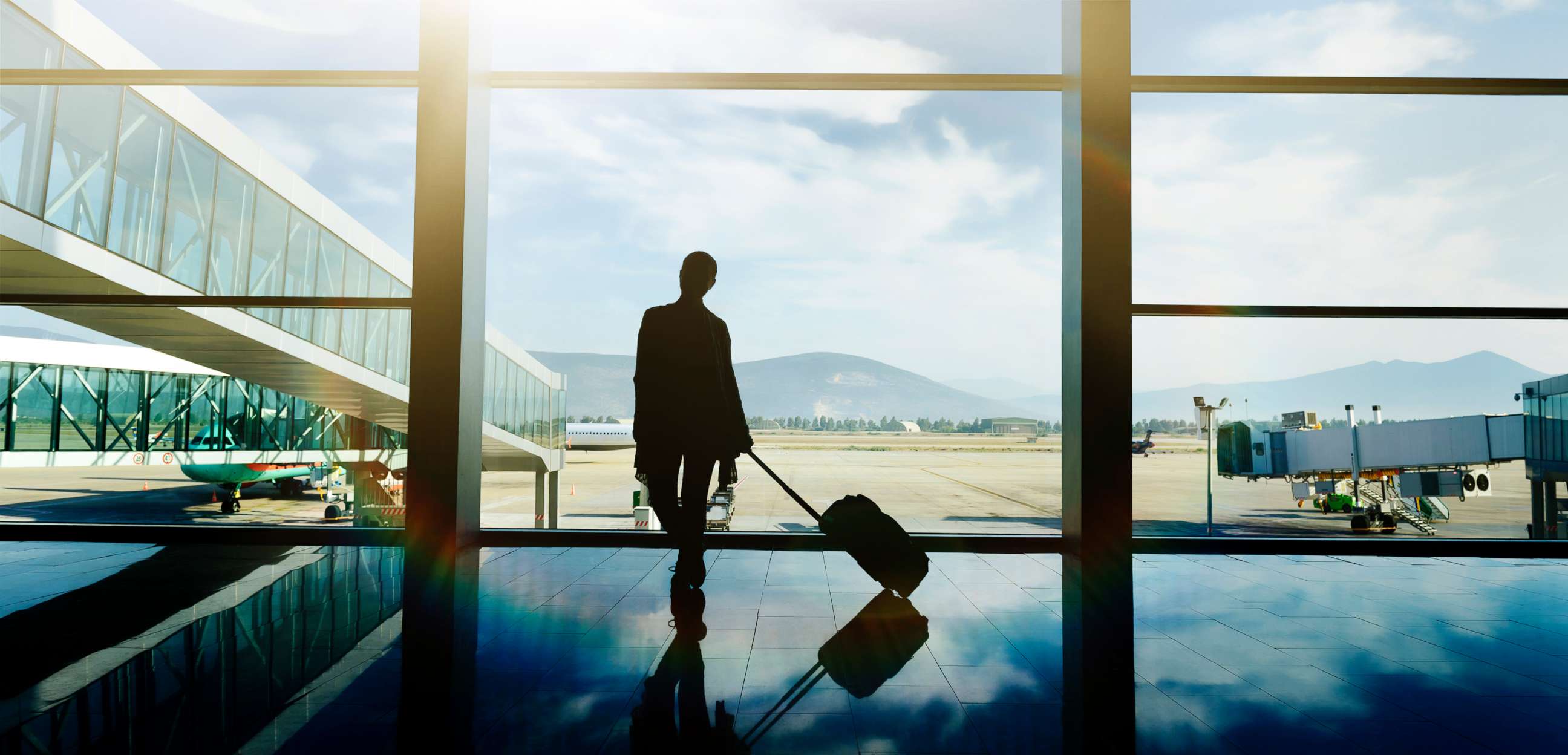 PHOTO: A traveler waits at the airport with luggage in this undated stock photo.
