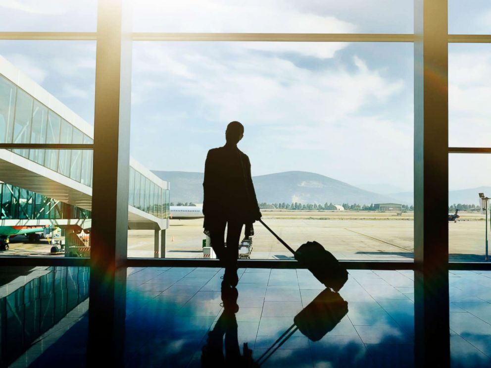 PHOTO: A traveler waits at the airport with luggage in this undated stock photo.