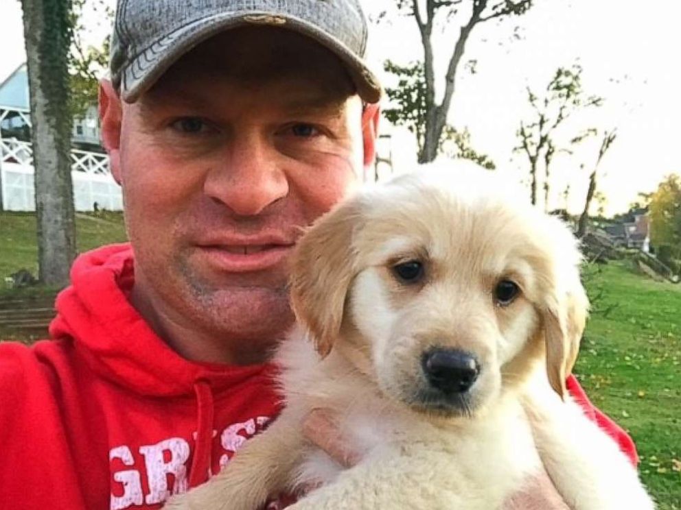 PHOTO: Troy Rogers poses with Clementine, a puppy that was a gift from his high school students. 