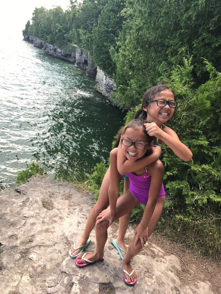 PHOTO: Reunited twin sister Audrey Doering and Gracie Rainsberry have fun together on a joint family trip this summer.