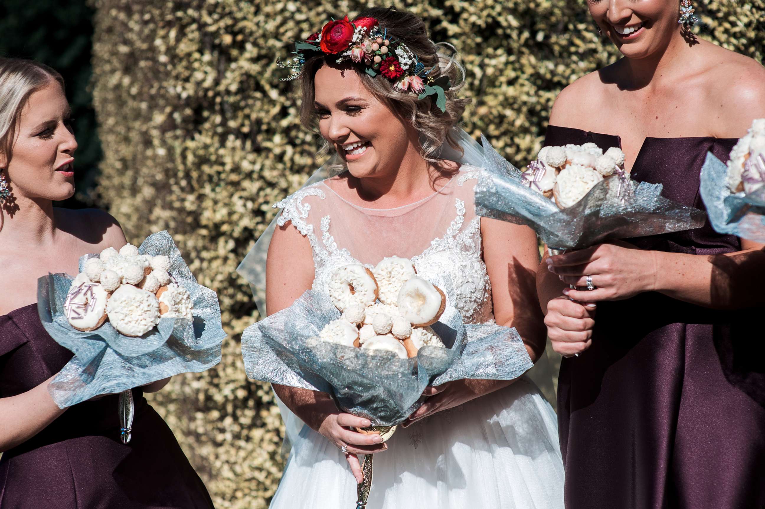 PHOTO: Bride Paige Burgess from Australia chose to carry a bouquet of doughnuts down the aisle.