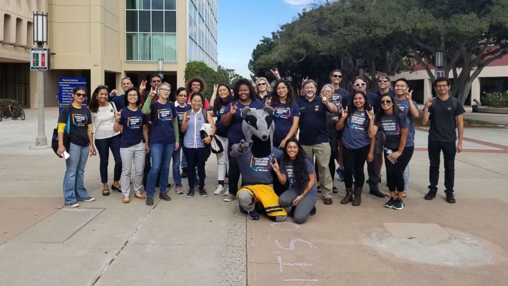 PHOTO: First-generation college students and faculty pose together at the University of California Irvine.