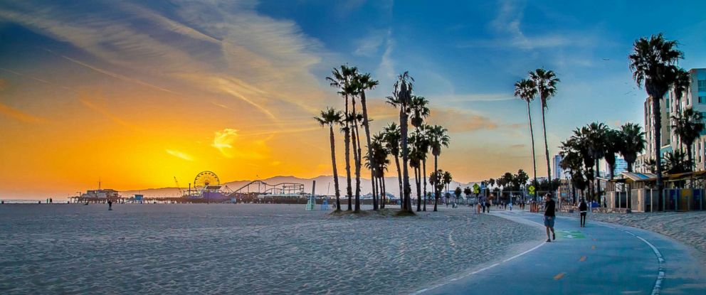 PHOTO: A vivid sunset is seen over Venice Beach with Santa Monica Pier in the distance in this undated stock photo.